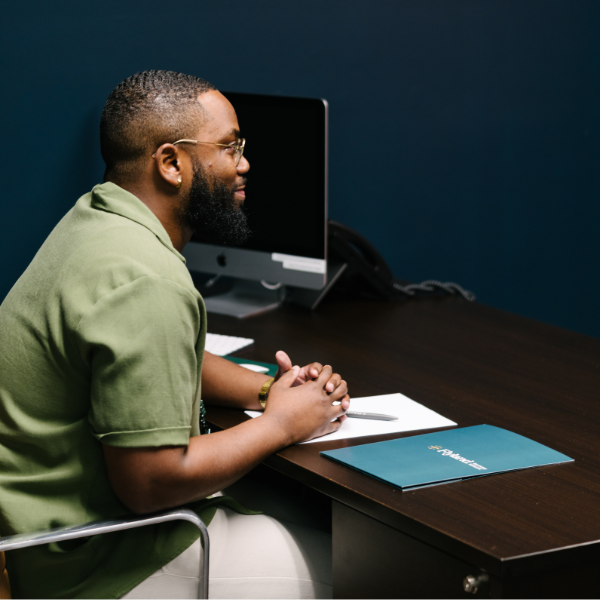 A man working with a therapist in Ember's residential inpatient program